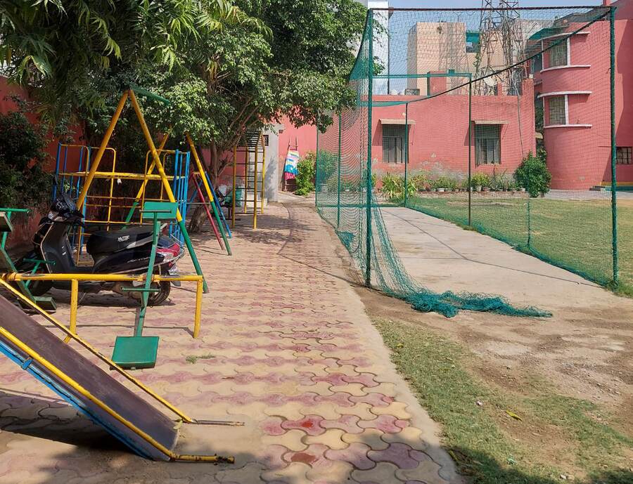 Campus pathway and play area at the school in Uttam Nagar